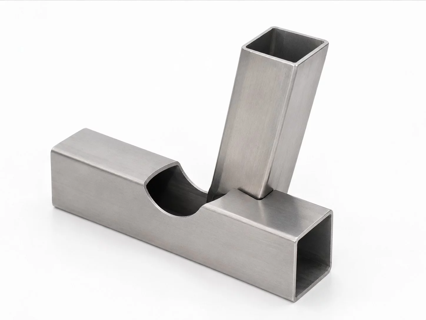 Fish-mouth saddle cuts for intersecting tubes
